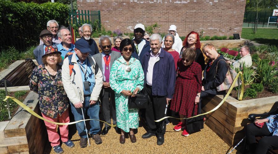 The Worshipful Mayor of Barnet, Cllr Nagus Narenthira, cuts the ribbon to officially open the new sensory garden in Victoria Park, Finchley.