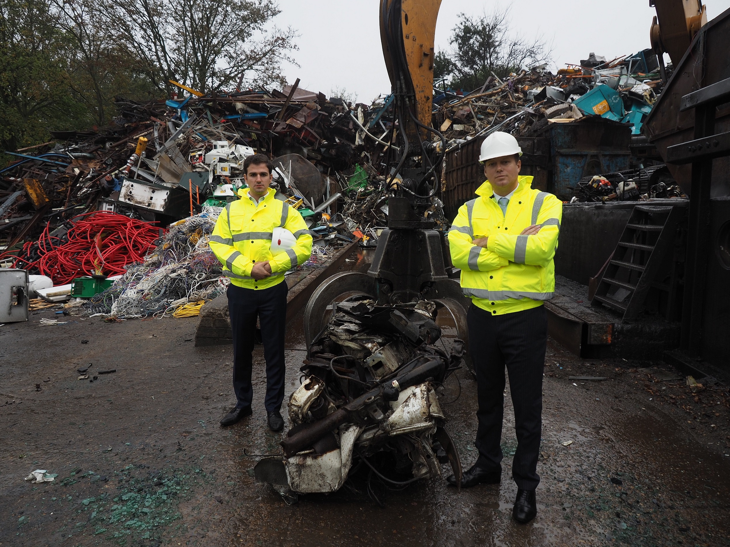 After: Councillor Roberto Weeden-Sanz (left), Chair of the Safer Communities Partnership Board, and Leader of Barnet Council, Councillor Dan Thomas, at the truck crushing