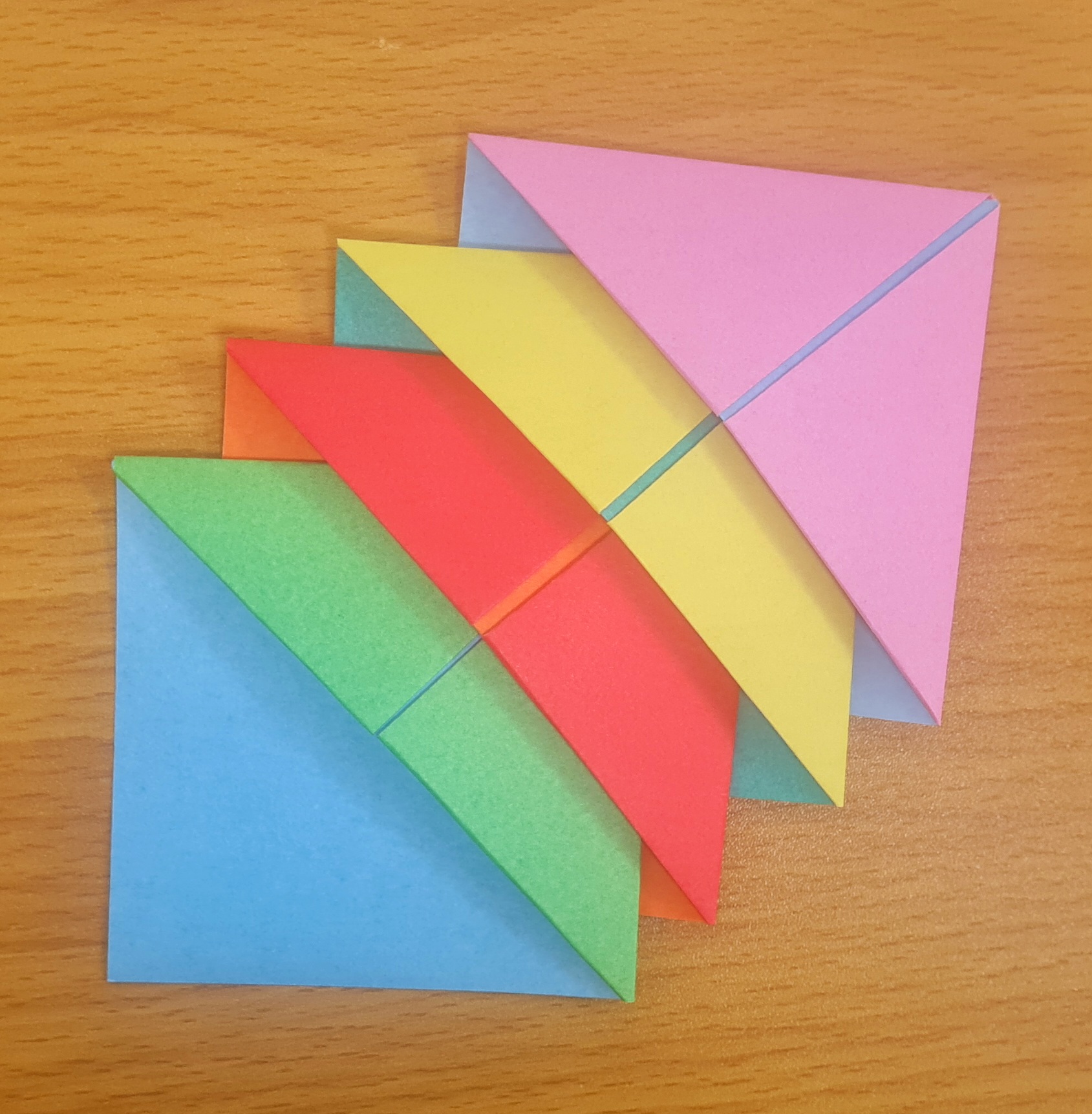 Origami image of folded sheets of coloured paper