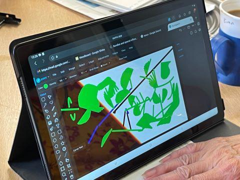 Tablet screen showing an art piece made in Jackson Pollock style.